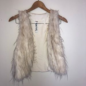 White furry vest